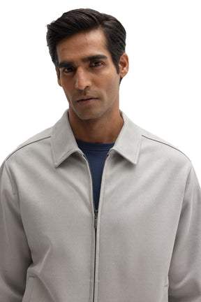 Close-up of front zipper and shirt collar on Robert Barakett men's light gray textured zip overshirt