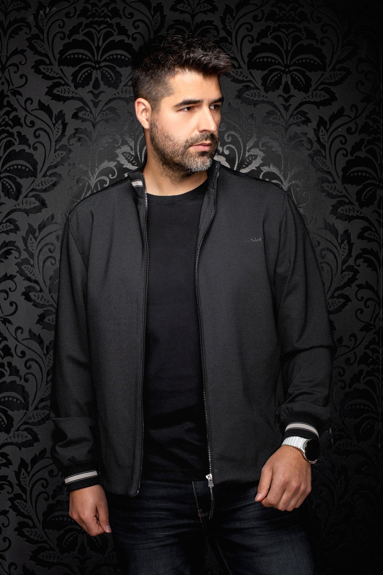Au Noir men's black textured bomber jacket with zip closure and small tonal chest logo shown from the front