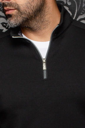 Au Noir men's black quarter-zip sports jacket with stand collar, silver zipper, and patterned inner trim, close-up