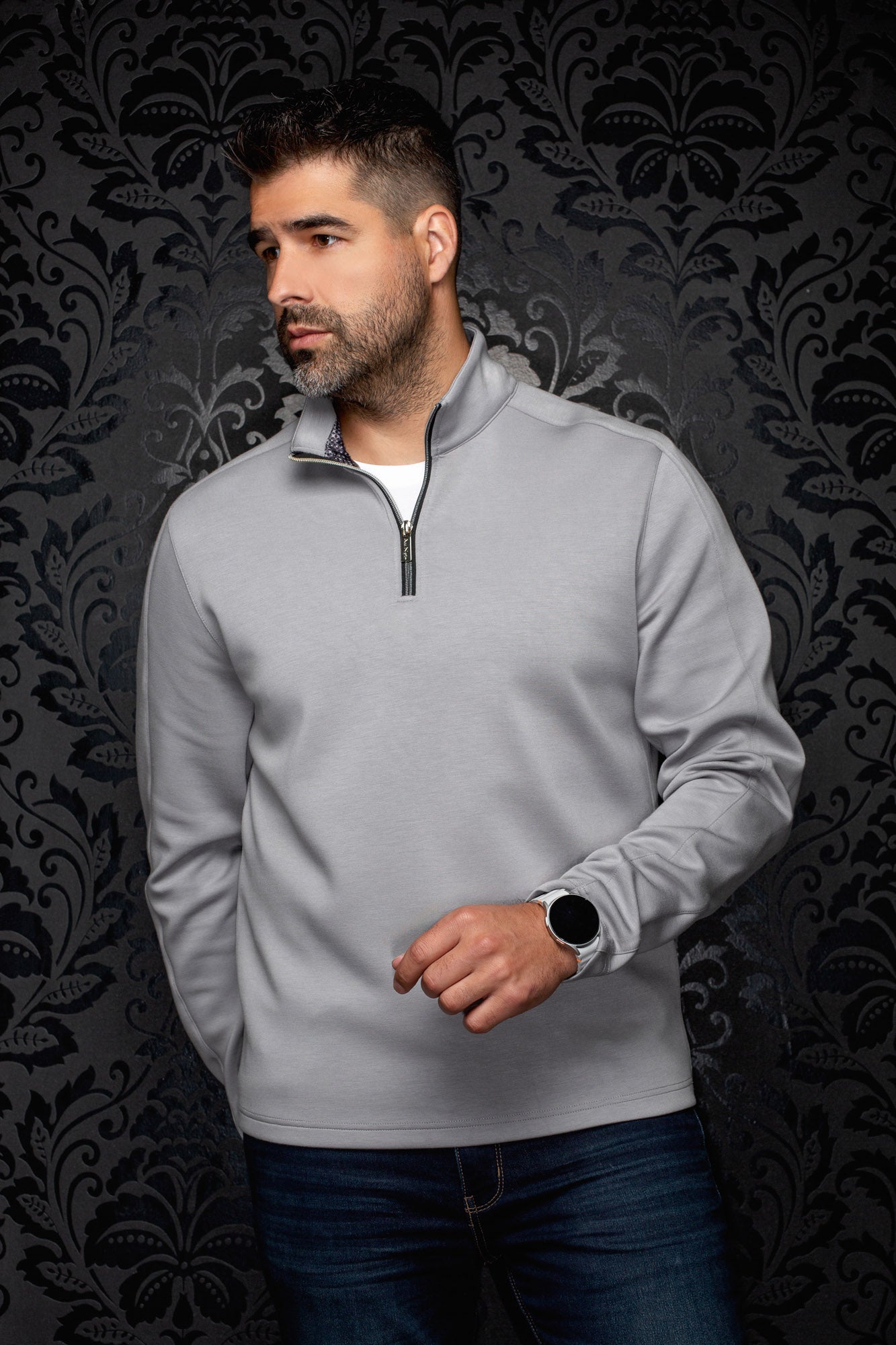 Men's light gray quarter-zip sports jacket with stand collar, front model view by Au Noir