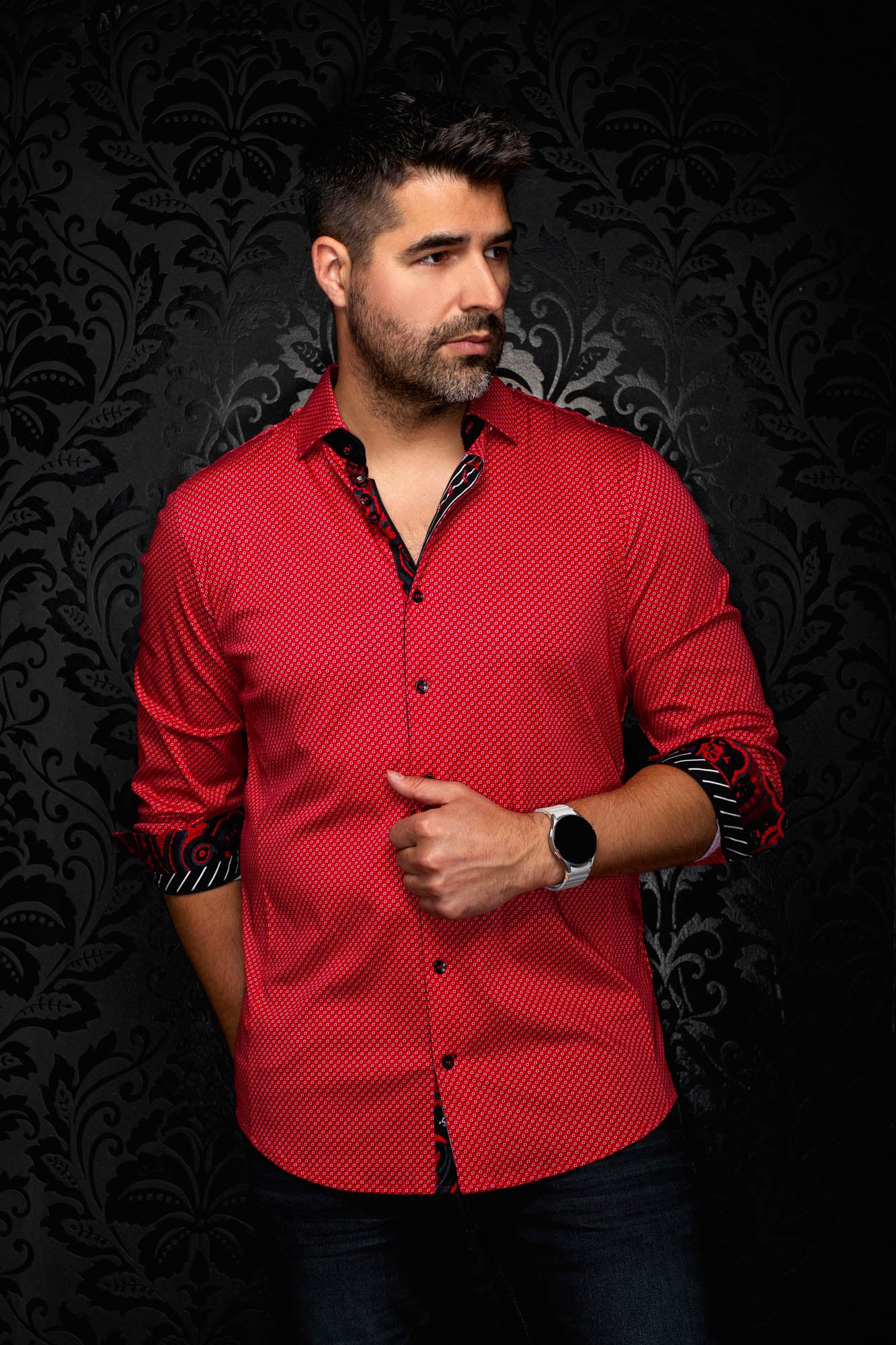 Men's red geometric print button-up shirt on model, with rolled sleeves showing black contrast cuffs, front view by Au Noir