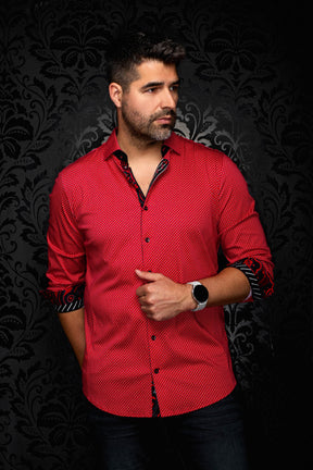 Men's red geometric print button-up shirt on model, with rolled sleeves showing black contrast cuffs, front view by Au Noir