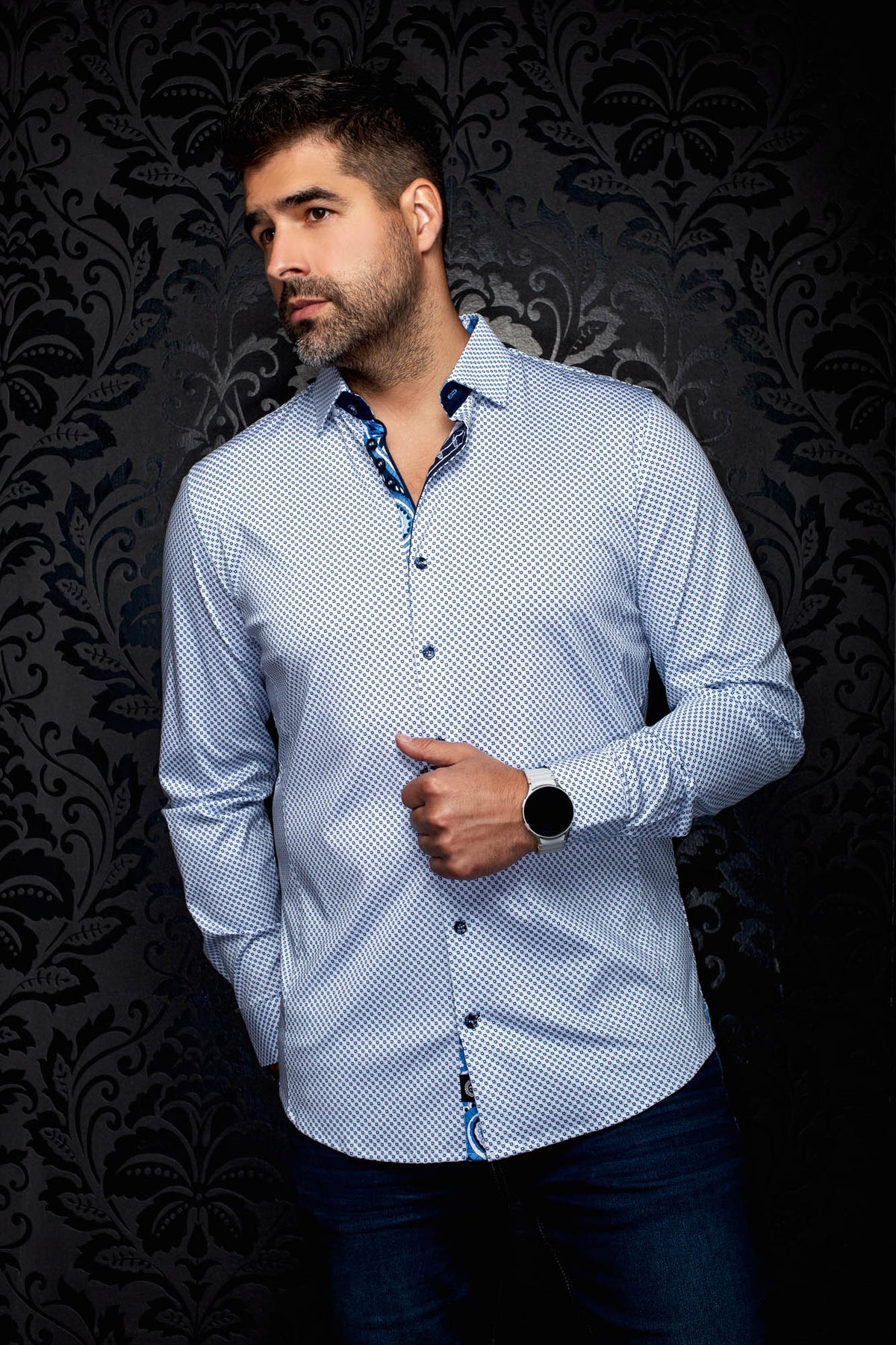 Men's front angled view of white patterned button-up shirt with navy collar trim and dark buttons, side view by Au Noir