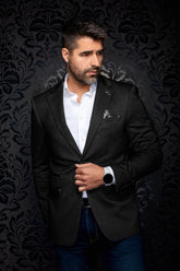 Men's black textured blazer front view on model, with notch lapels and a chest pocket square by Au Noir