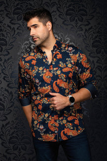 Au Noir men's navy button-up shirt with orange paisley floral print, front model view with rolled sleeves