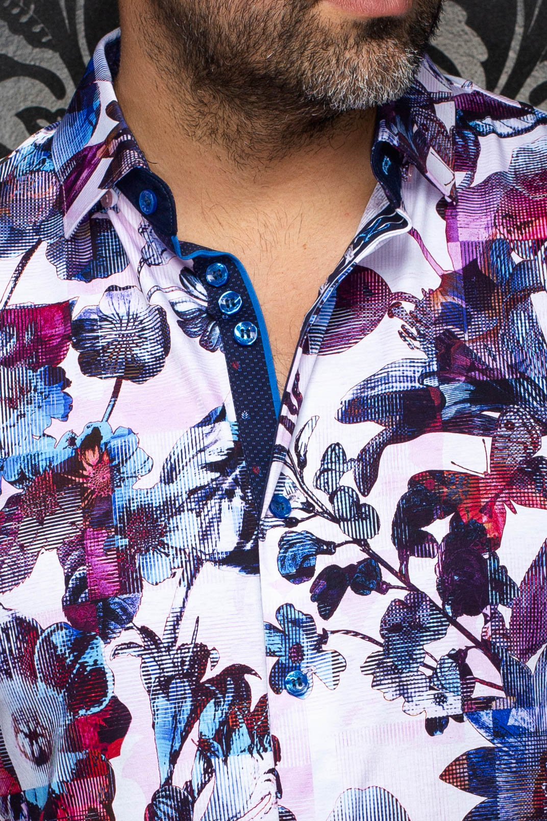 Au Noir men's light pink floral button-up shirt with blue buttons and navy contrast placket, close-up