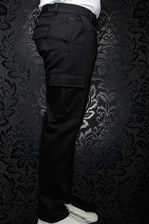 Au Noir men's black cargo pants with flap leg pocket, belt loops, and small back-pocket metal tag, side view