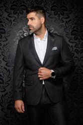 Front model view of men's dark charcoal blazer with notch lapels, flap pockets, and cuff buttons by Au Noir