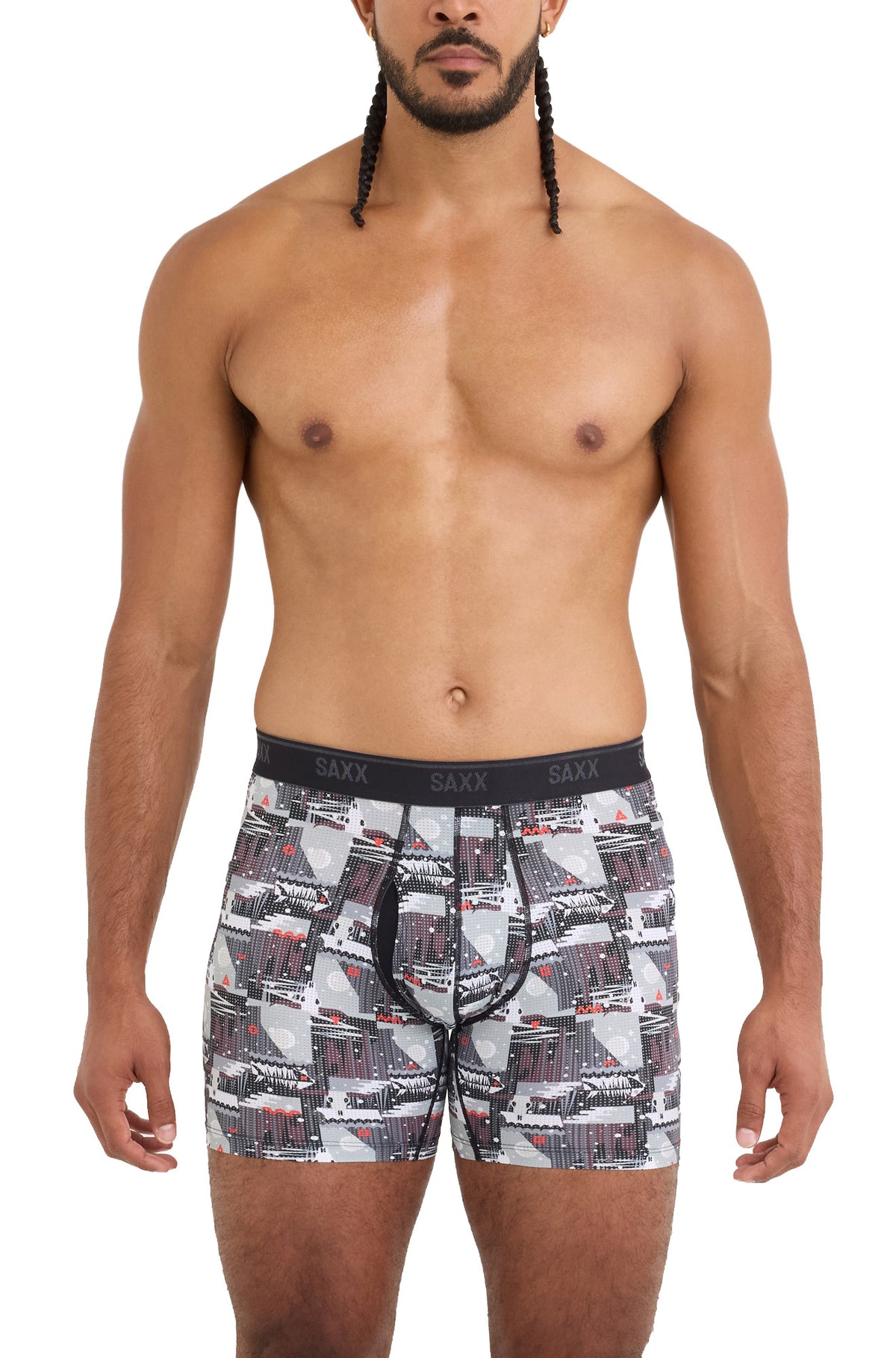Saxx men's cropped front model view of gray printed boxer underwear with black logo waistband and pouch