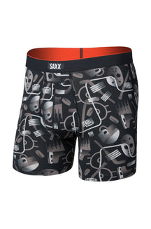 Men's black printed boxer underwear with red-orange interior and SAXX waistband shown from the front