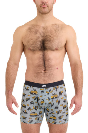 Saxx men's light blue printed boxer briefs on model with black SAXX waistband and pouch seams, front view