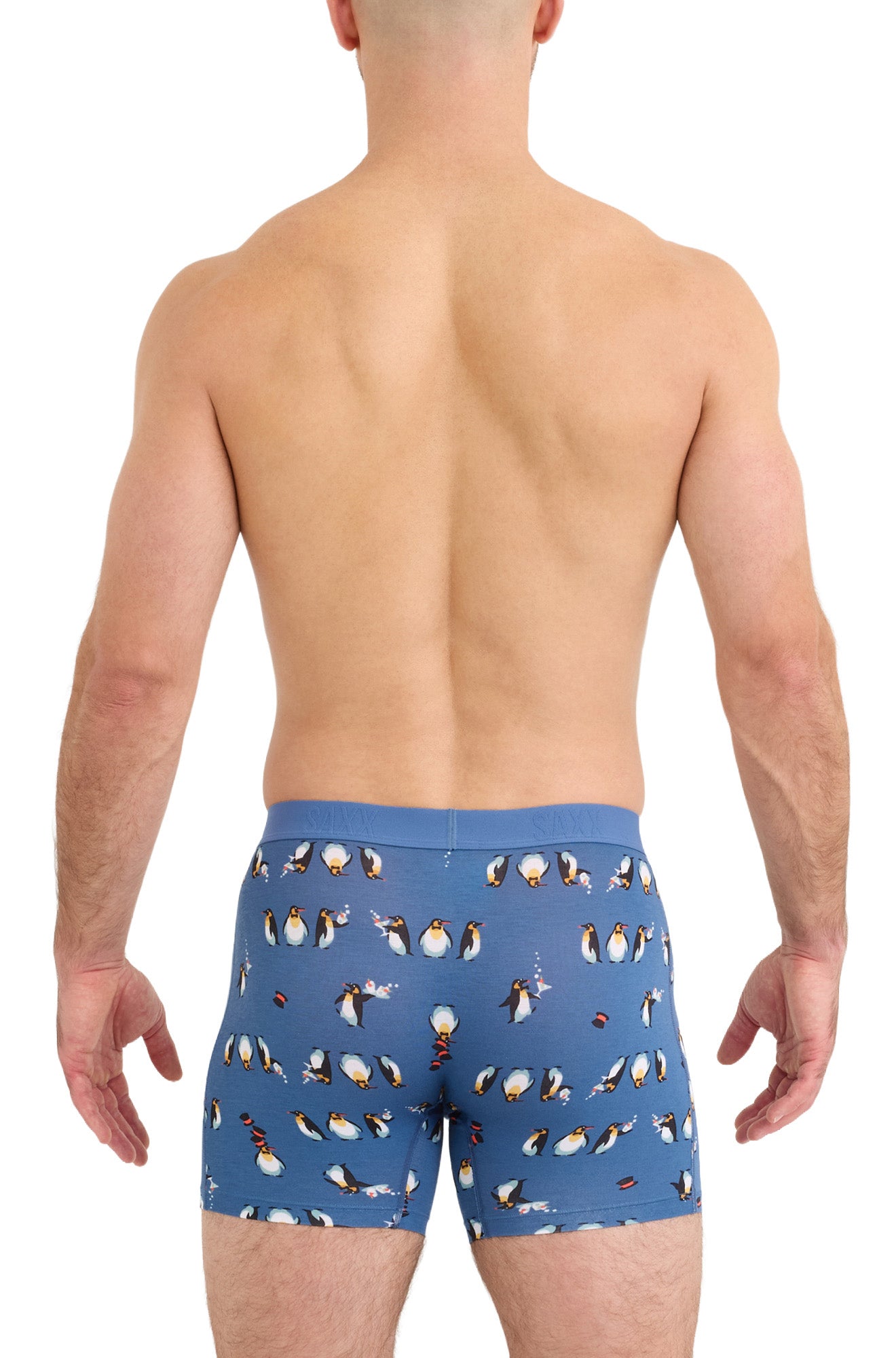 Saxx men's blue boxer underwear with elastic waistband and allover penguin print shown from the back