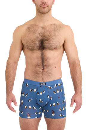 Saxx men's blue boxer underwear with blue logo waistband and penguin print shown from the front