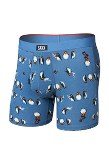Isolated front view of men's blue boxer underwear with logo waistband, pouch seams and penguin print by Saxx
