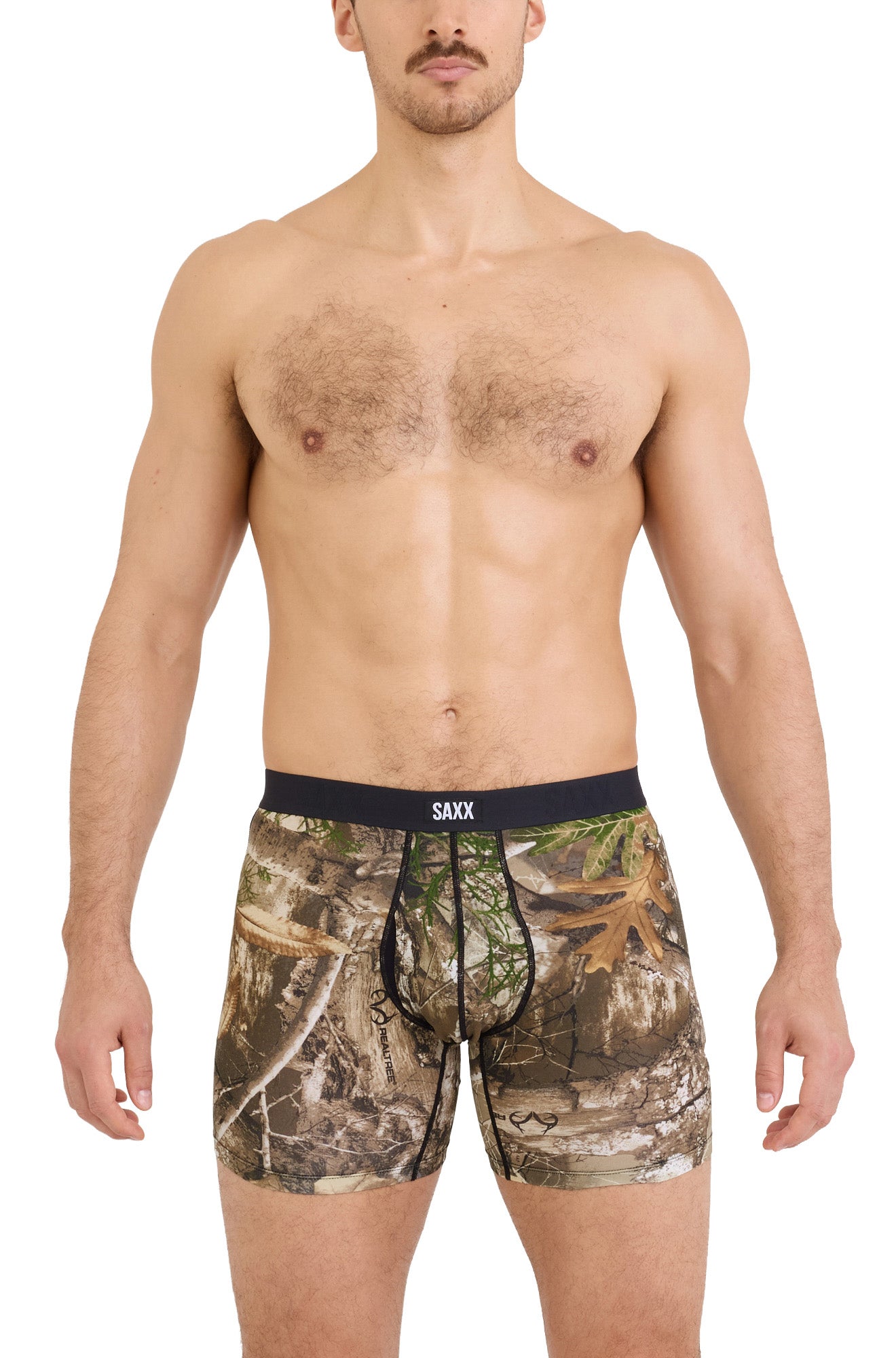 Men's brown woodland camouflage boxer underwear with pouch seams and black SAXX waistband shown from the front