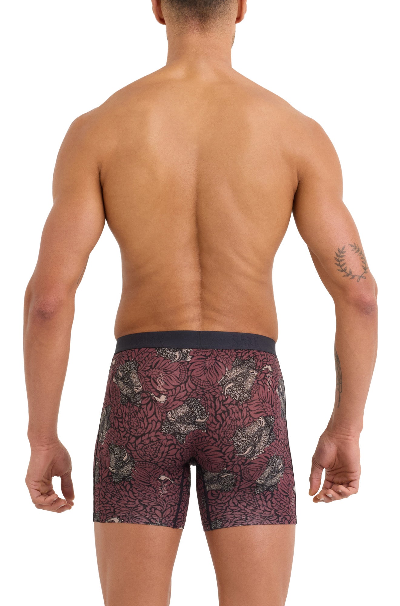 Men's model back view of burgundy printed boxer briefs with animal floral print and black waistband by Saxx