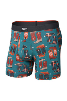 Men's teal boxer underwear with black SAXX waistband and western boot print shown from the front
