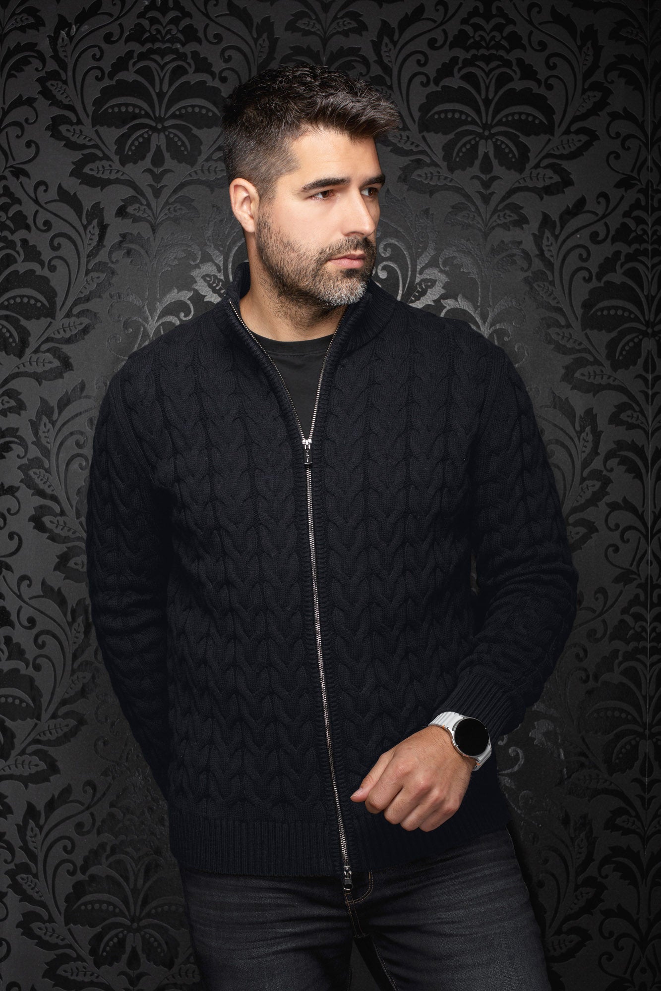 Men's black cable-knit zip merino sweater on model, front view with ribbed collar, cuffs, and hem by Au Noir