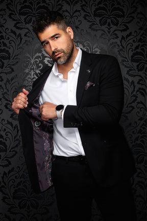 Men's angled view of a black blazer opened to show dark paisley lining with burgundy accents, detail view by Au Noir