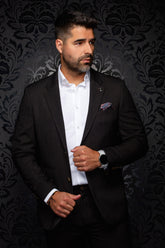 Au Noir men's dark brown blazer with notched lapels, chest pocket, and gold-tone cuff buttons, front view